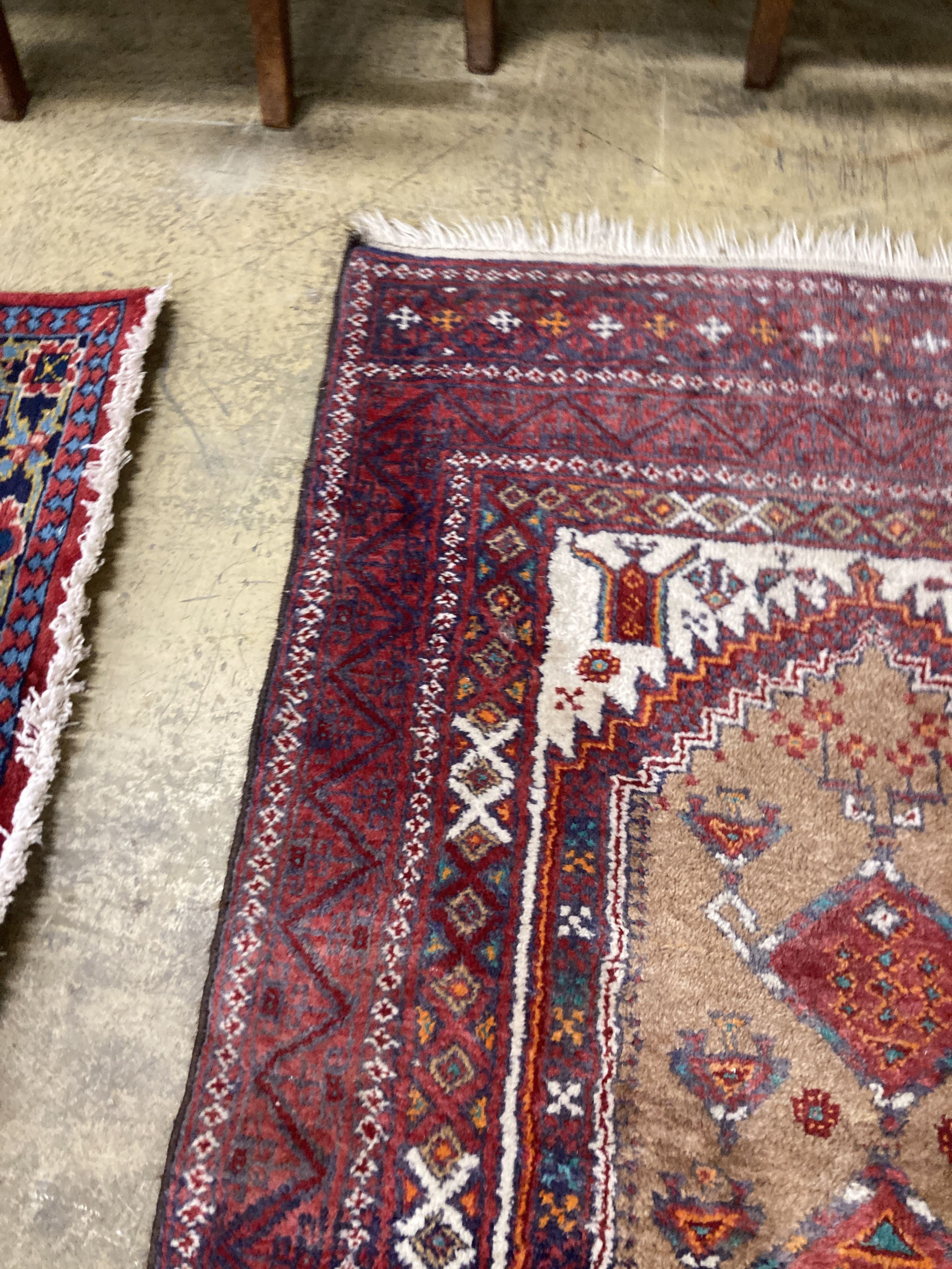 A Caucasian design red ground rug, 206 x 134cm together with a smaller West Persian design rug